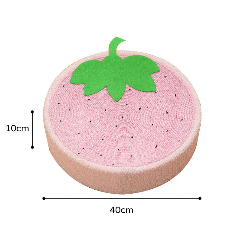 Round pink sisal cat scratch pad with green leaf detail in a cozy, modern pet accessory design