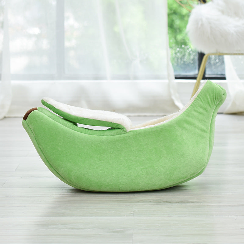 Plush modern green pet bed shaped like a banana with soft removable washable lining for comfort