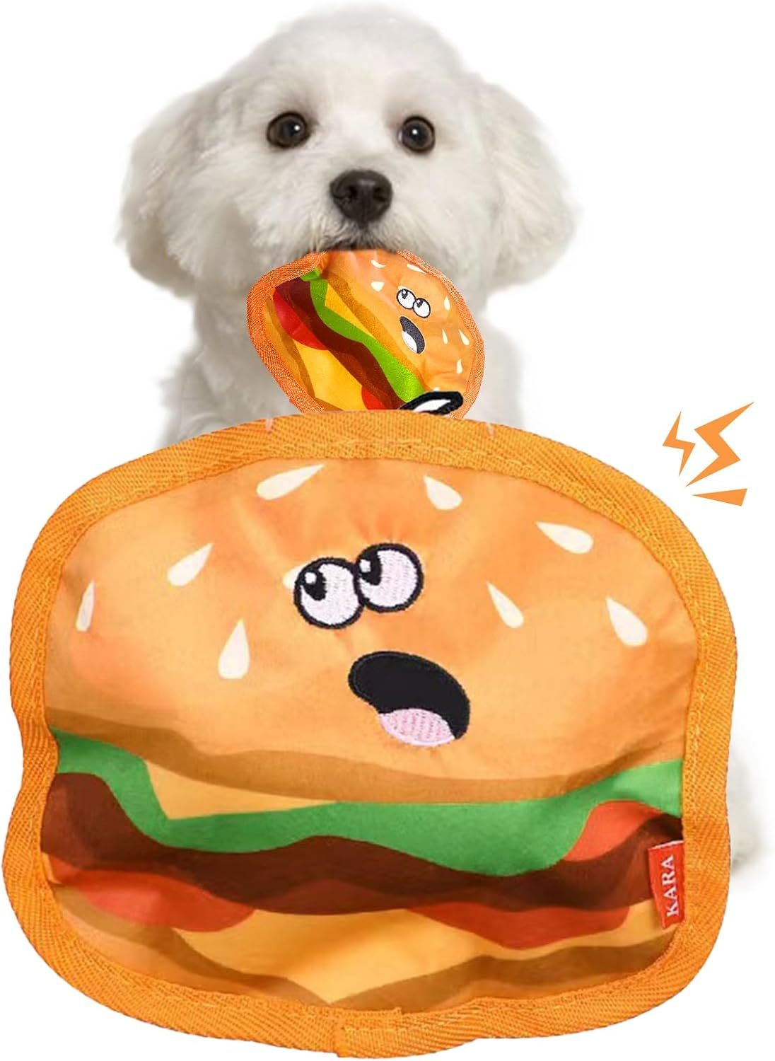 Small white dog holding a durable orange chew toy shaped like a playful hamburger with textured fabric