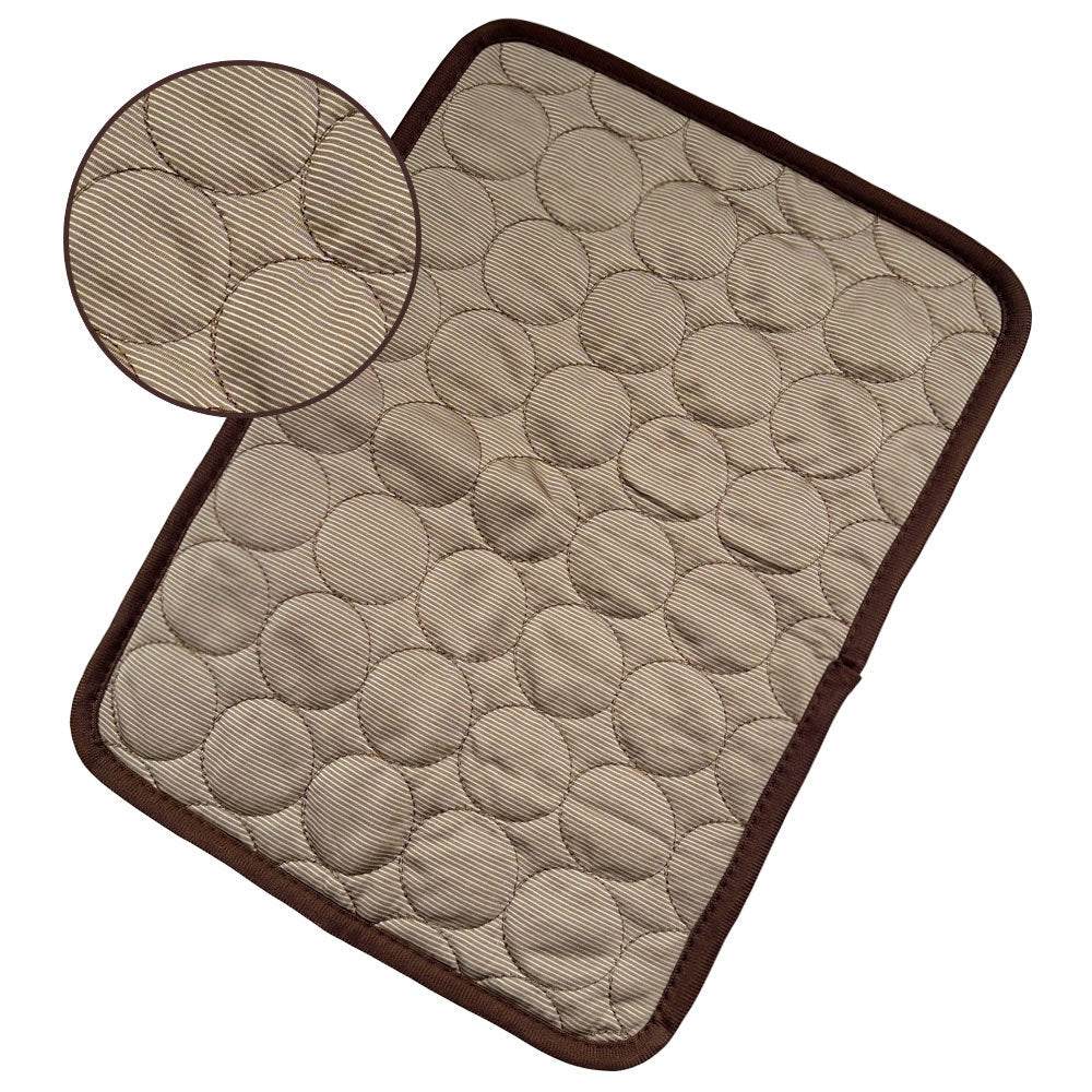 Beige textured cooling pet mat with circular quilted pattern and dark brown trim edges