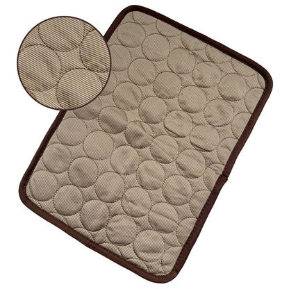 Beige textured cooling pet mat with circular quilted pattern and dark brown trim edges