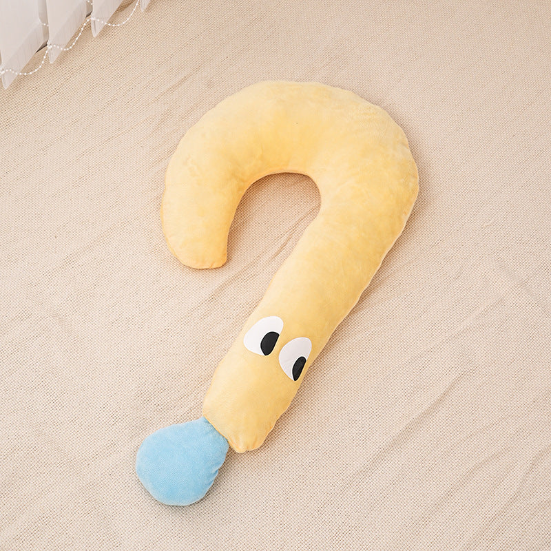 Curved plush pet pillow in soft yellow and blue with playful eyes, ideal luxury cushion for small pets.