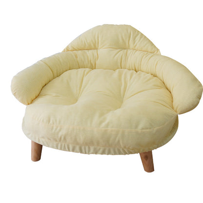 Cozy off-ground cat bed with wooden legs and plush cushioned fabric in soft cream color