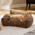 Cozy indoor pet sofa with plush ribbed texture in warm brown, featuring a relaxed cat lounging comfortably